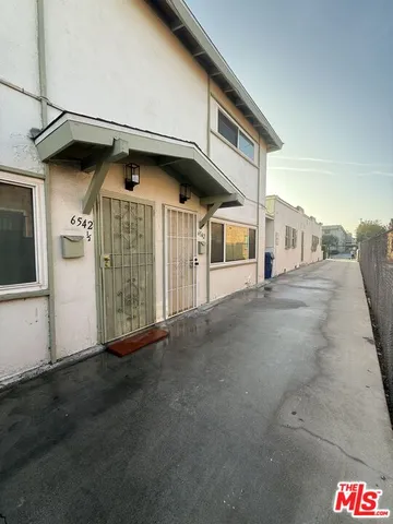 a view of parking area and car parked