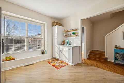 a kitchen with stainless steel appliances a stove a sink and a refrigerator