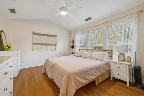a bathroom with a double vanity sink toilet and a mirror