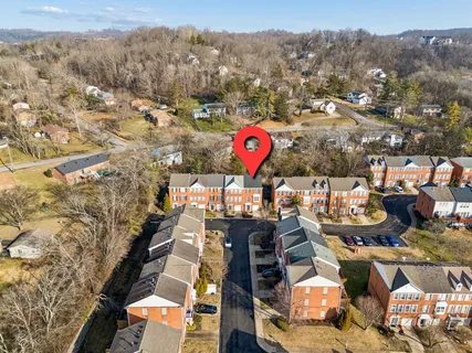 a view of a brick house with windows