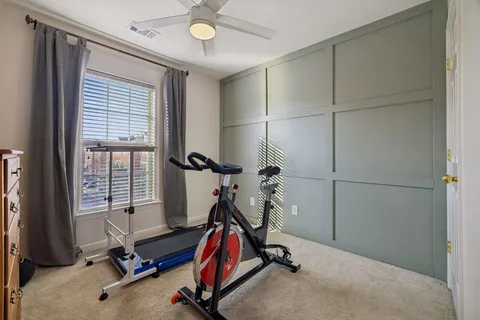 a work room with furniture and a window