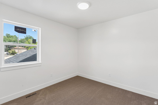 1617 North Angel Street Layton, UT 84041 - Photo 13 of 43 Carpeted spare room featuring baseboards