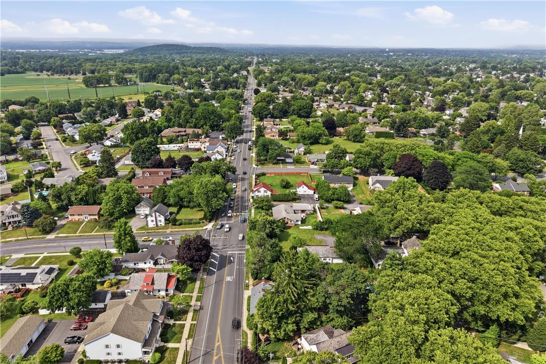 2014 Linden Street Bethlehem, PA 18017 - Photo 83 of 85 An aerial perspective reveals a tree-lined neighborhood with well-maintained homes bordering a serene landscape.