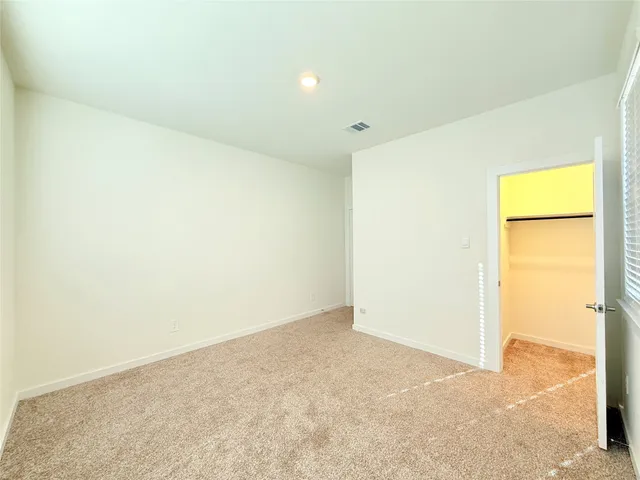 a view of a room with cabinet and white walls
