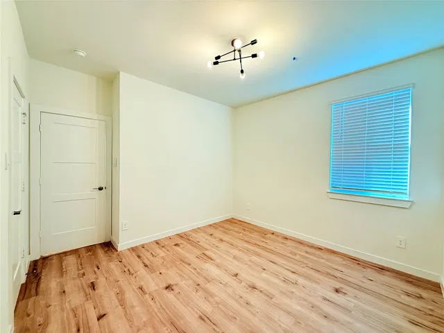 a view of workspace with wooden floor and window