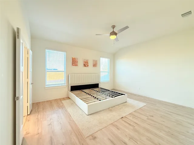 a bathroom with a granite countertop sink a large mirror a shower and a bathtub