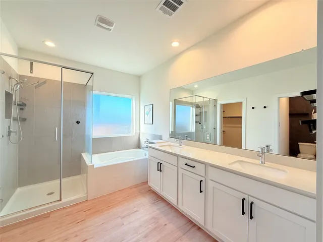 a view of a bathroom from a hallway