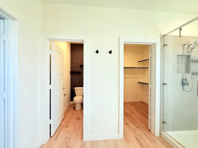 a bathroom with a tub a sink and a shower