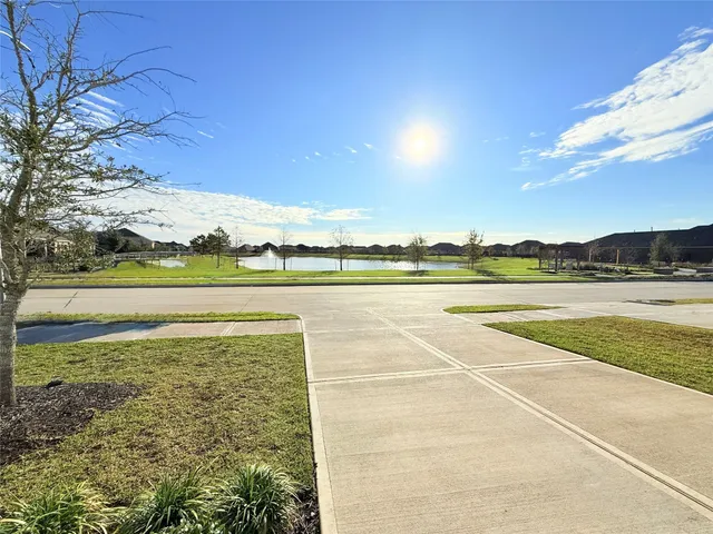 a view of an outdoor space and tennis court