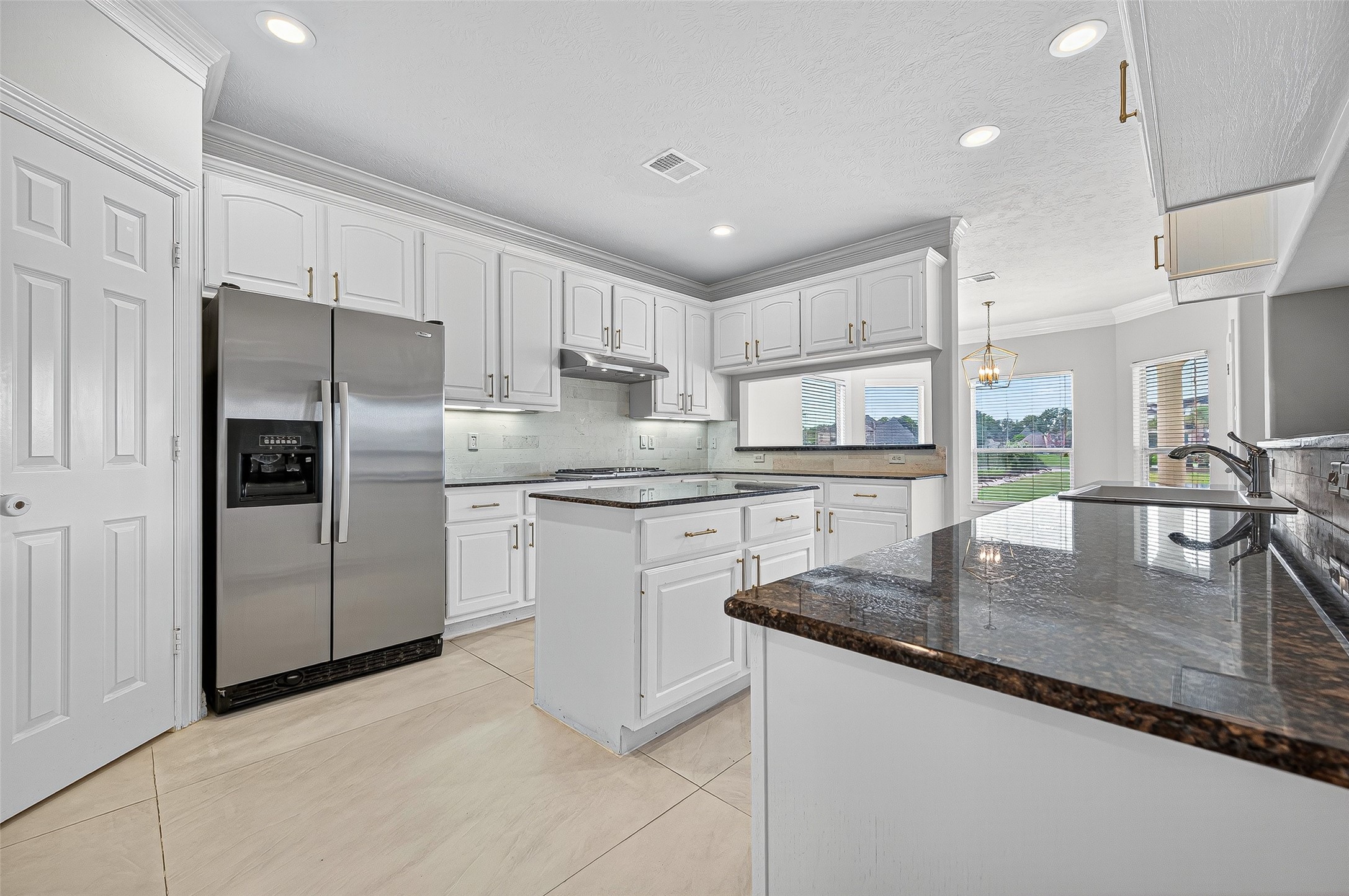 1902 Sparrows Ridge Katy, TX 77450 - Photo 10 of 48 a kitchen with stainless steel appliances granite countertop a sink refrigerator and cabinets