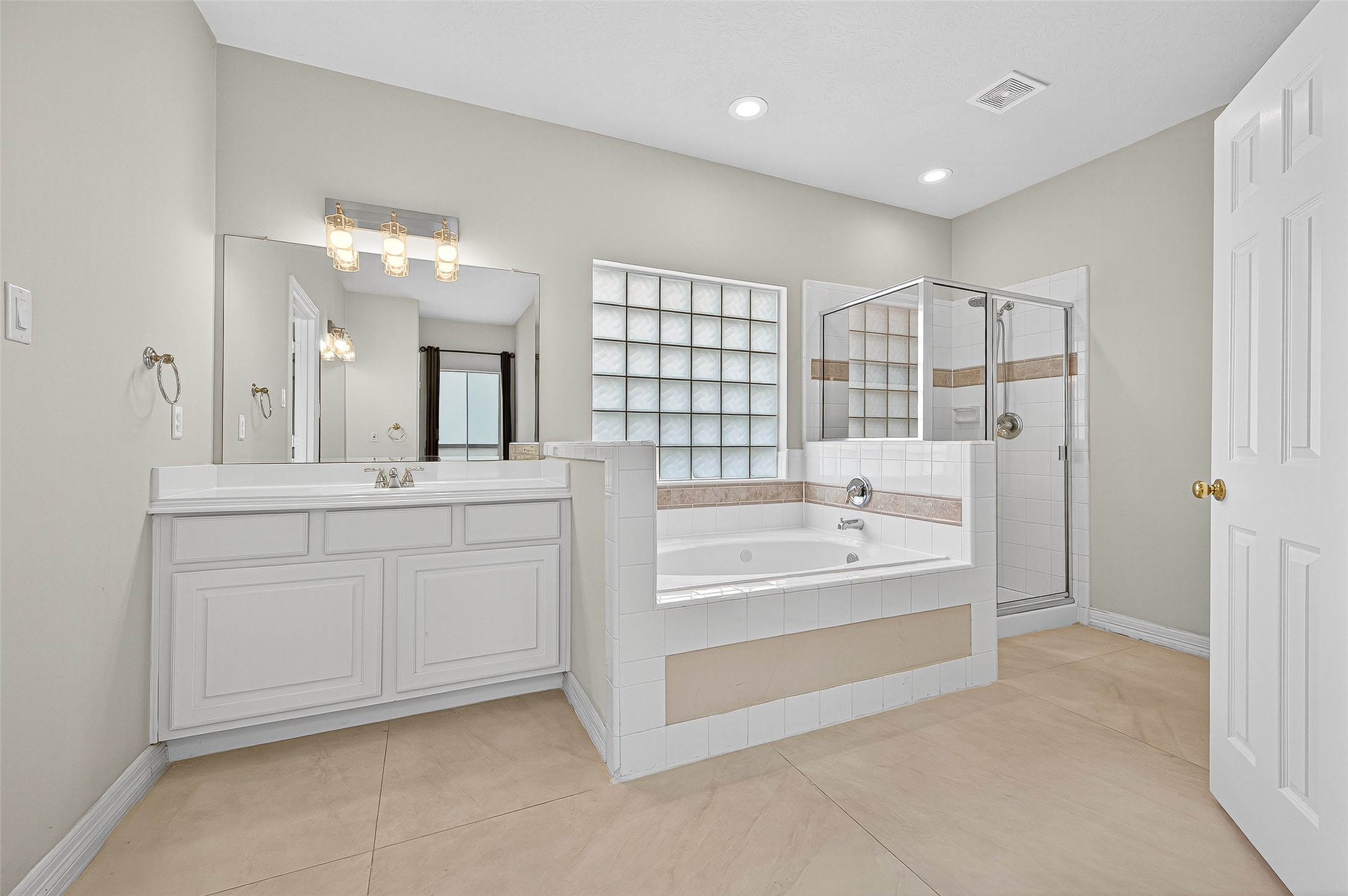 1902 Sparrows Ridge Katy, TX 77450 - Photo 18 of 48 a spacious bathroom with a tub sink and mirror