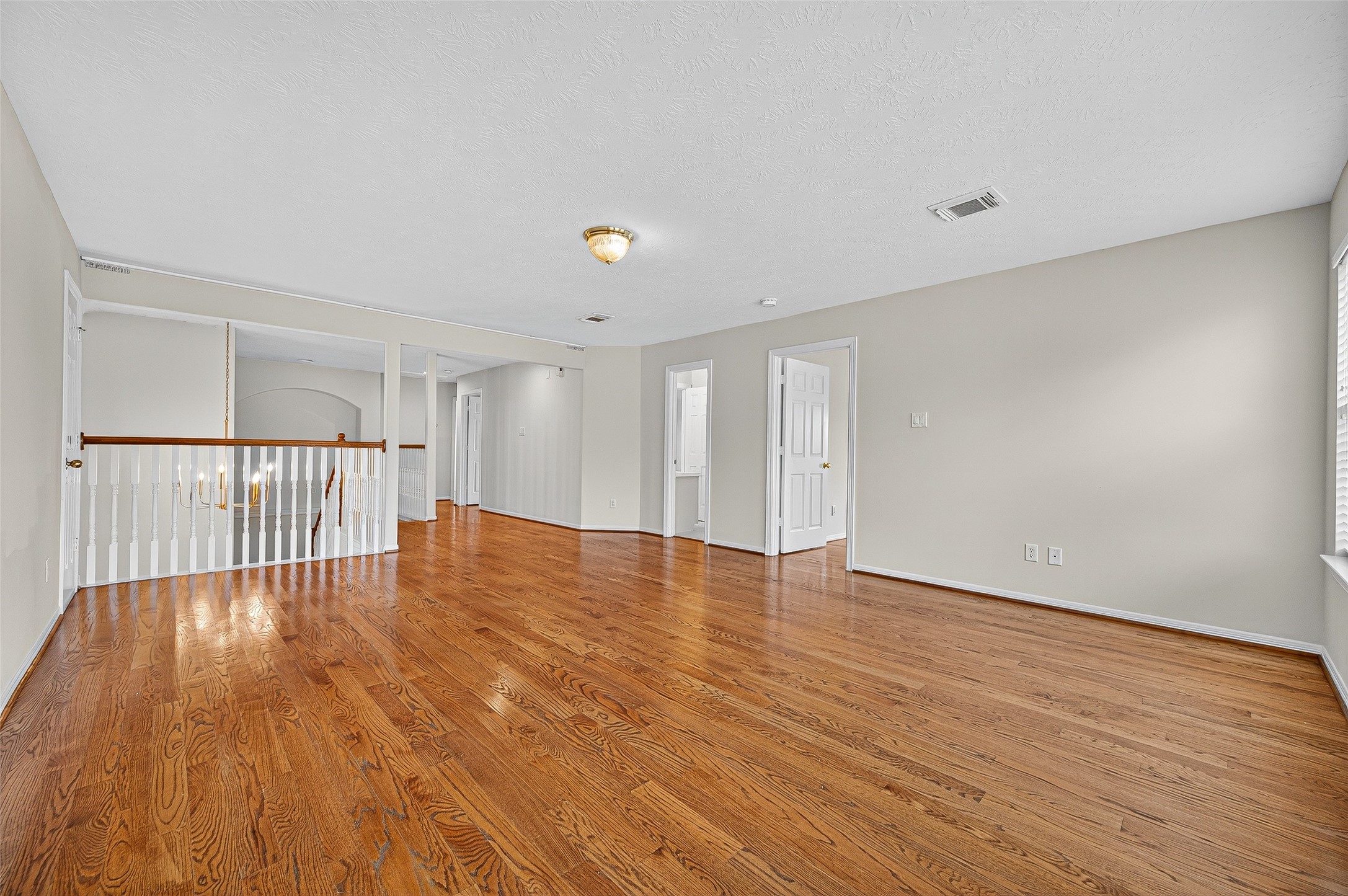 1902 Sparrows Ridge Katy, TX 77450 - Photo 21 of 48 a view of an empty room with wooden floor