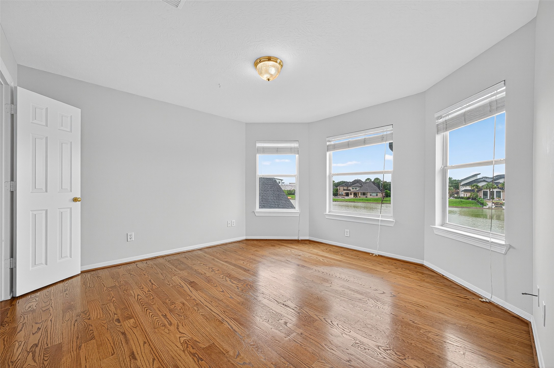 1902 Sparrows Ridge Katy, TX 77450 - Photo 23 of 48 a view of an empty room with window and wooden floor
