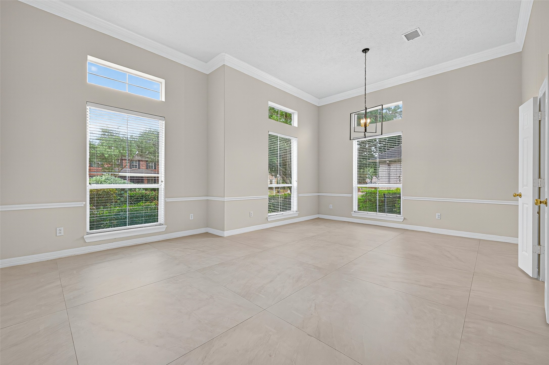 1902 Sparrows Ridge Katy, TX 77450 - Photo 5 of 48 a view of an empty room with a window and chandelier fan
