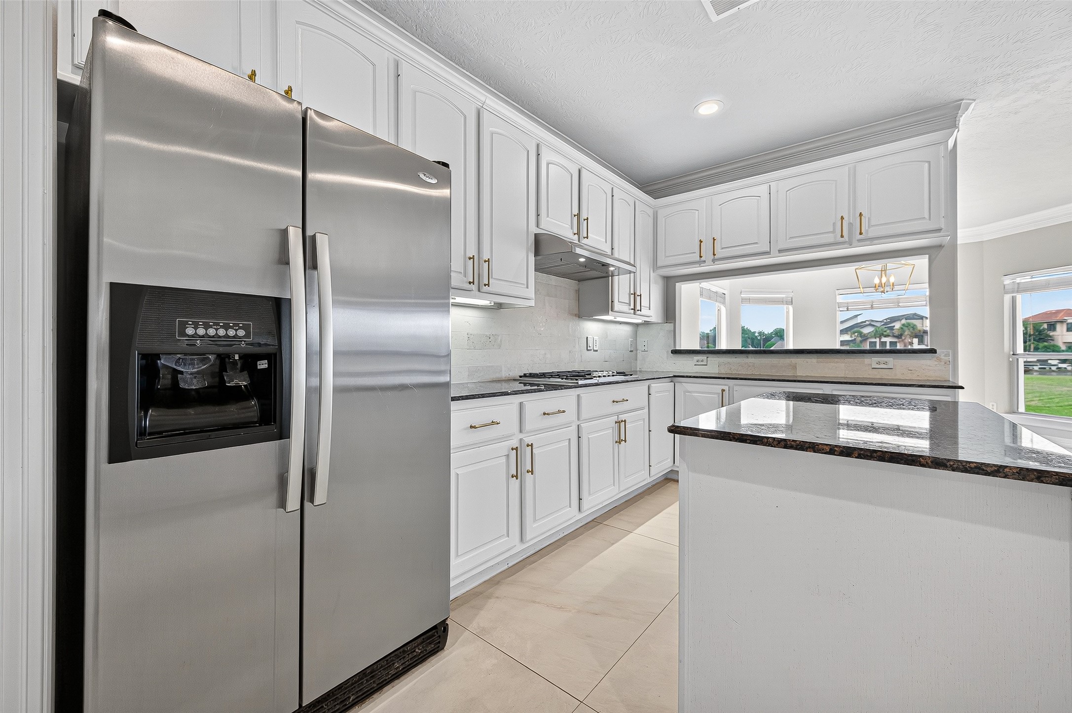 1902 Sparrows Ridge Katy, TX 77450 - Photo 9 of 48 a kitchen with stainless steel appliances granite countertop a refrigerator and a sink