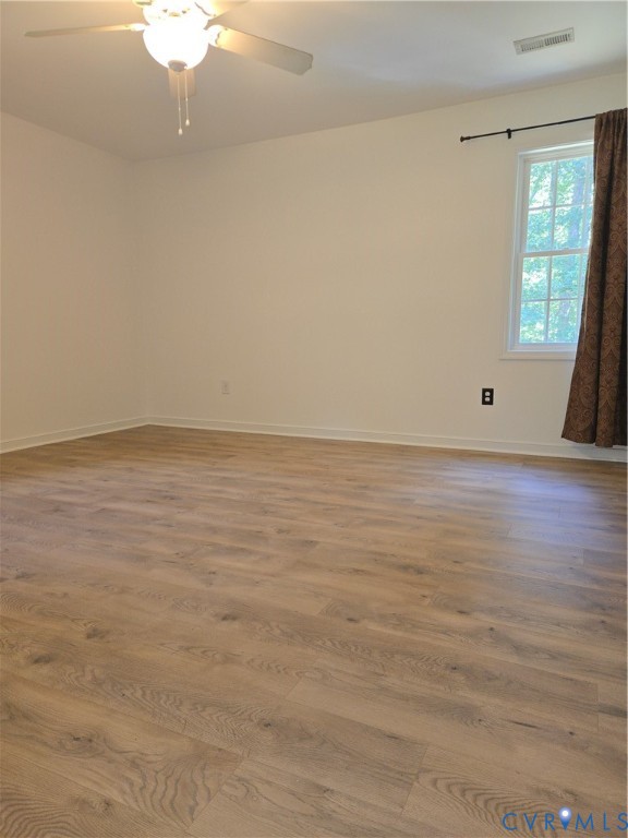 289 Winding Ridge Way Bumpass, VA 23024 - Photo 7 of 16 Wood-finish flooring, white walls, ceiling fan, an