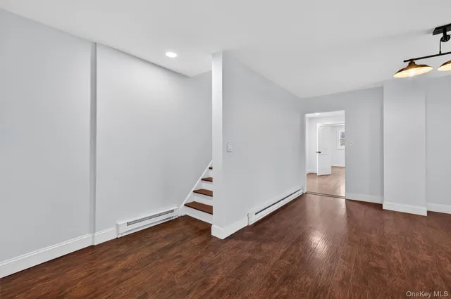 a bathroom with a toilet sink and shower