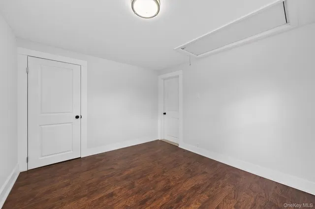 a view of a house with a yard covered in snow