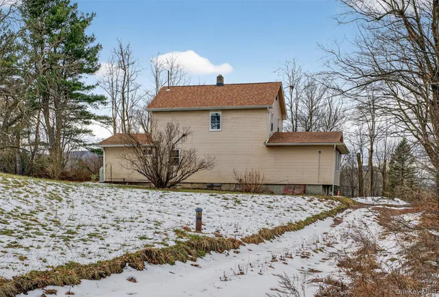 a view of yard covered with snow in outdoor space