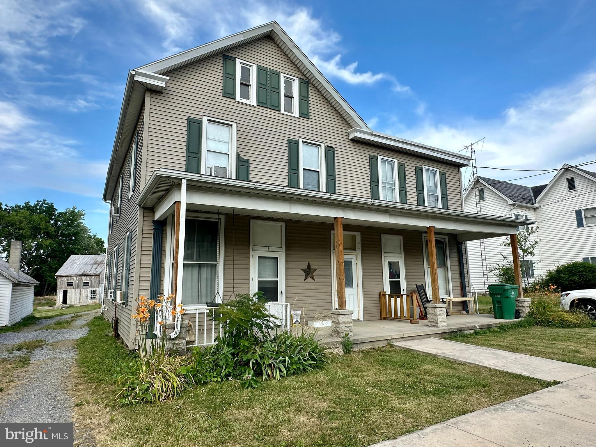 4576 Lemar Road, Unit 2A Mercersburg, PA 17236 - Photo 1 of 12 a front view of a house with garden