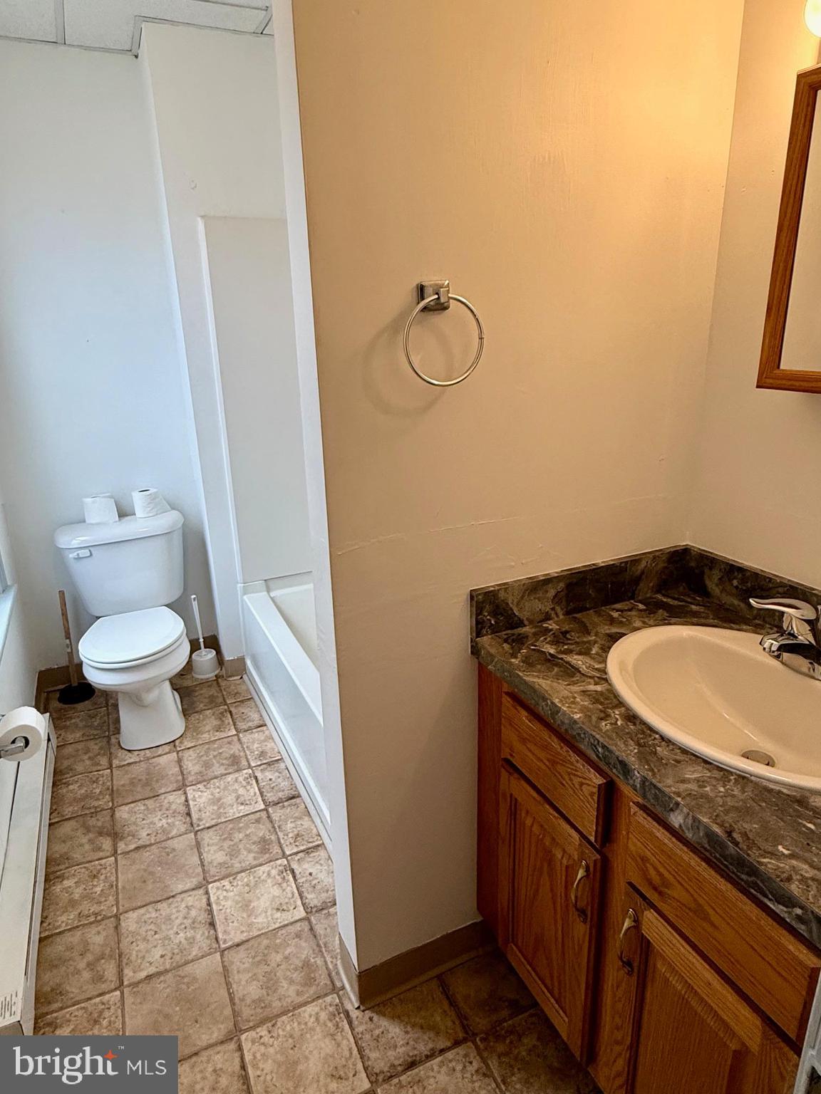 4576 Lemar Road, Unit 2A Mercersburg, PA 17236 - Photo 12 of 12 a bathroom with a granite countertop sink and a mirror