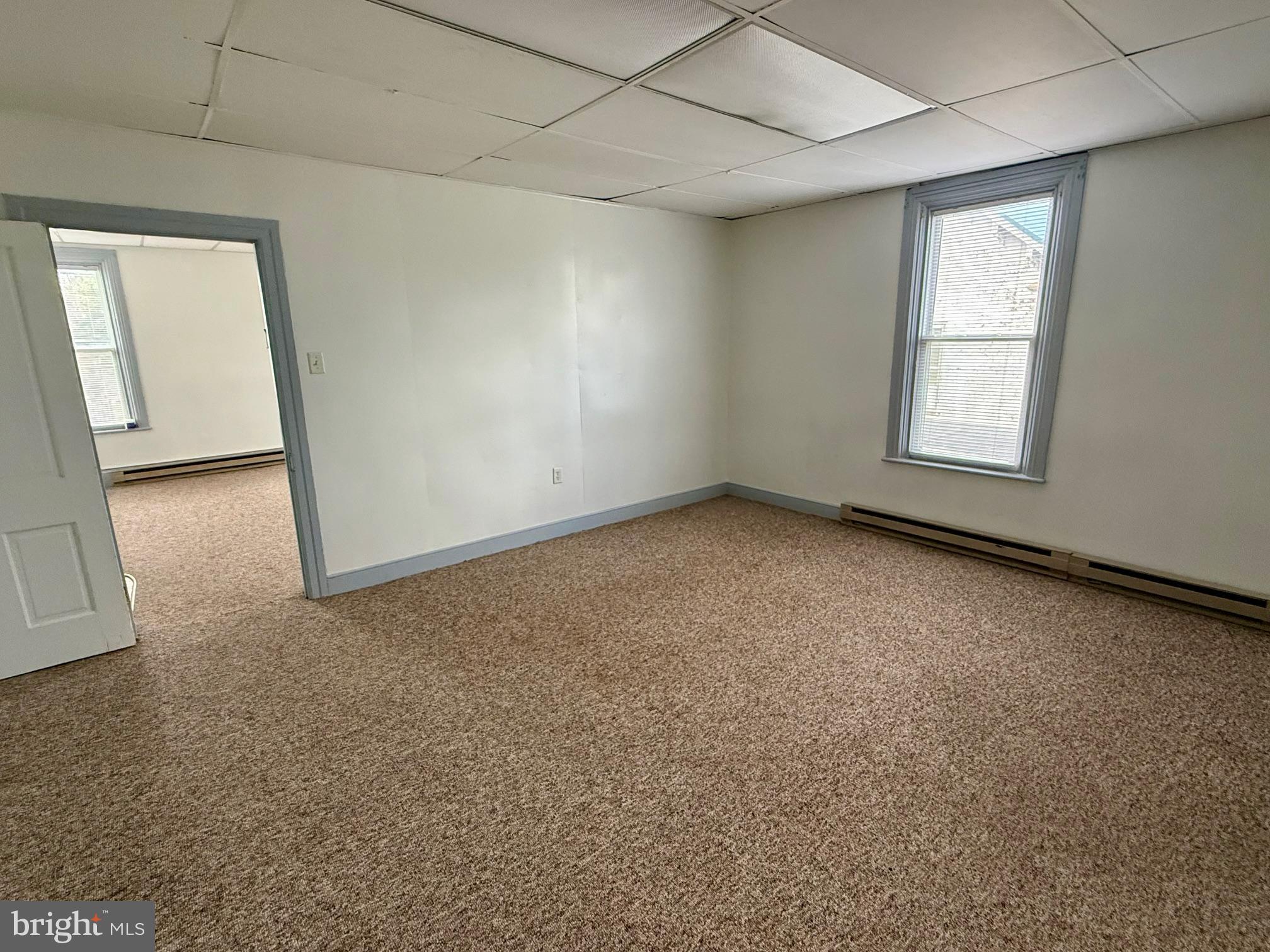 4576 Lemar Road, Unit 2A Mercersburg, PA 17236 - Photo 5 of 12 an empty room with a empty space and windows