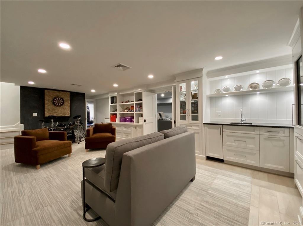 7 Whaling Road Darien, CT 06820 - Photo 23 of 34 a living room with furniture and a flat screen tv