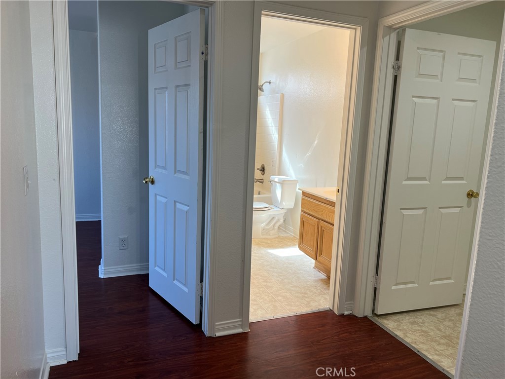40305 Reata Road Palmdale, CA 93550 - Photo 13 of 20 a view of a bathroom with wooden floor