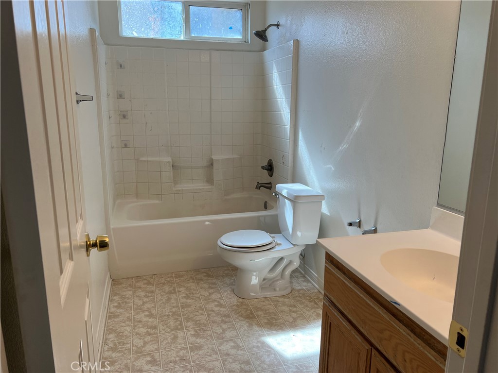 40305 Reata Road Palmdale, CA 93550 - Photo 15 of 20 a bathroom with a sink a toilet and a shower