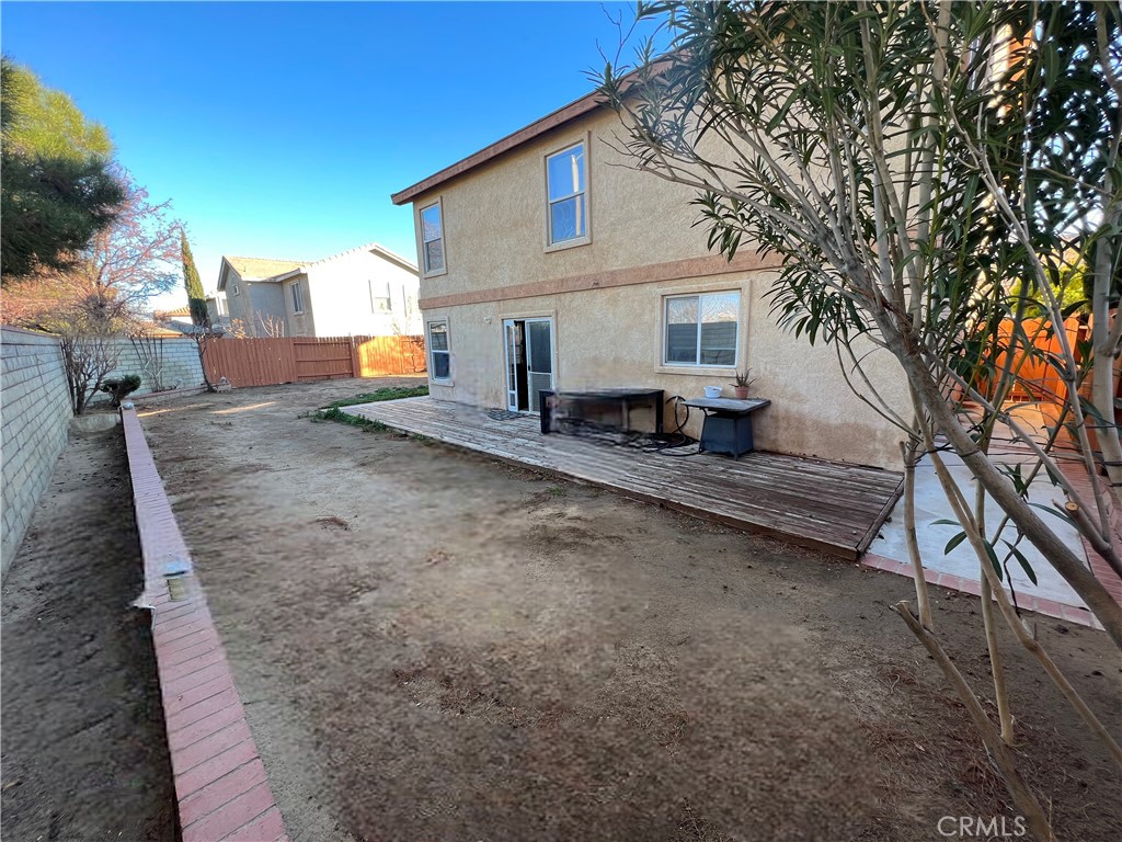 40305 Reata Road Palmdale, CA 93550 - Photo 18 of 20 a view of a house with a patio