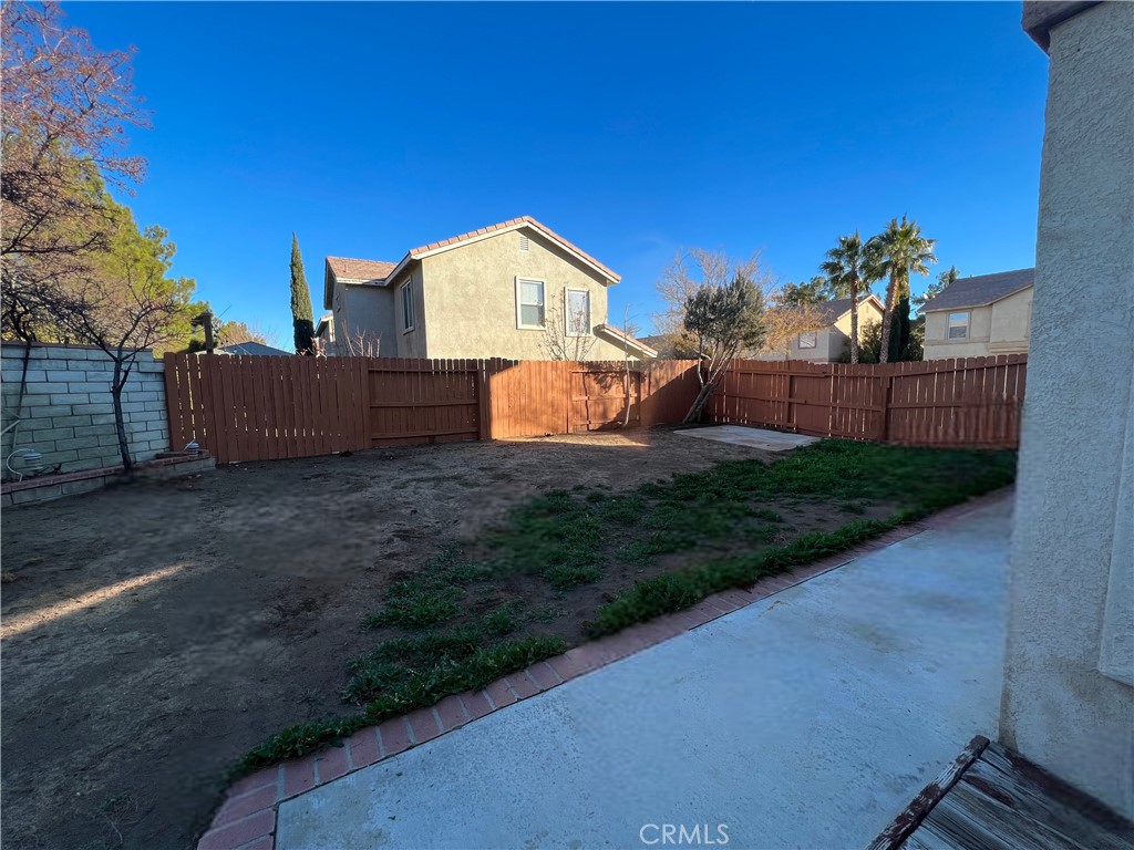 40305 Reata Road Palmdale, CA 93550 - Photo 20 of 20 a view of a yard with potted plants