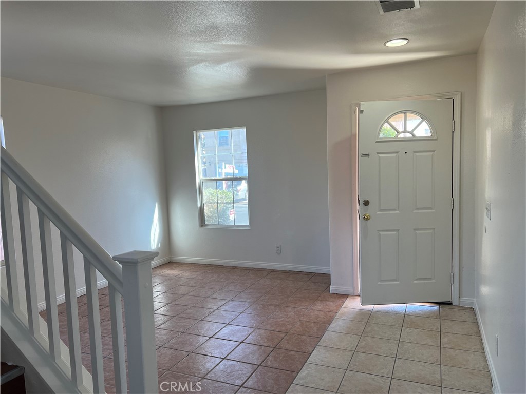 40305 Reata Road Palmdale, CA 93550 - Photo 3 of 20 a view of an empty room and window
