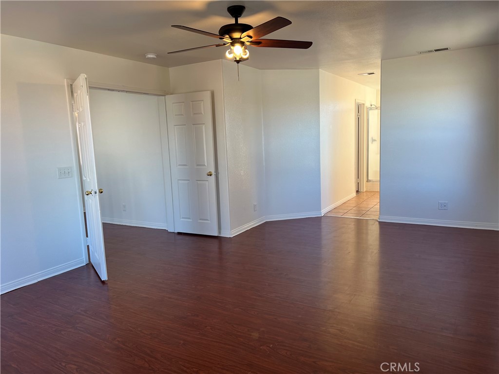40305 Reata Road Palmdale, CA 93550 - Photo 9 of 20 wooden floor in an empty room with a window