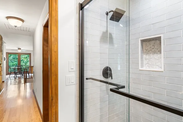a bathroom with a bathtub and a shower