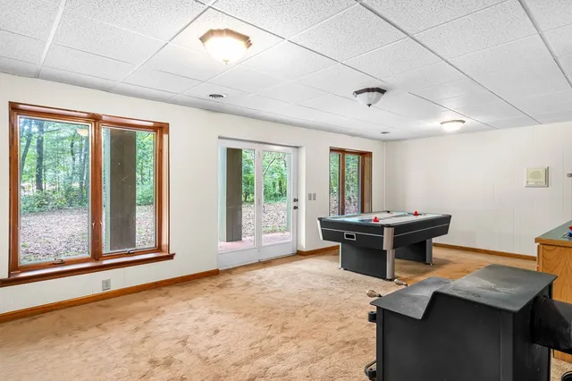 a view of a workspace with furniture window and outside view