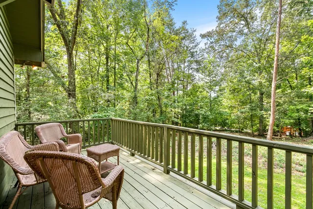 a view of a balcony with furniture