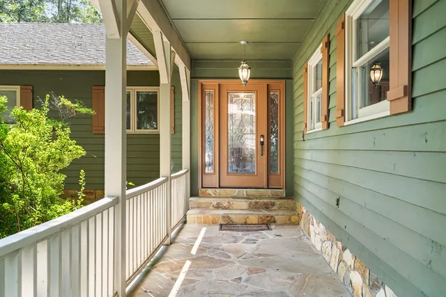 a view of a brick house with a large windows