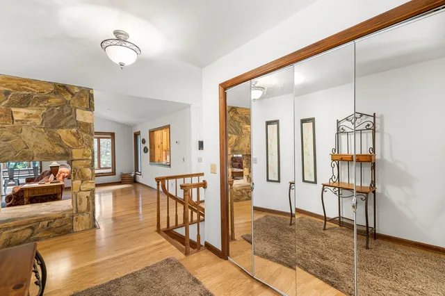 a view of a livingroom with furniture and hardwood floor