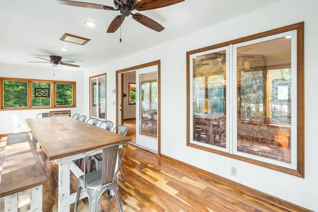 a view of a dining room with furniture window and wooden floor