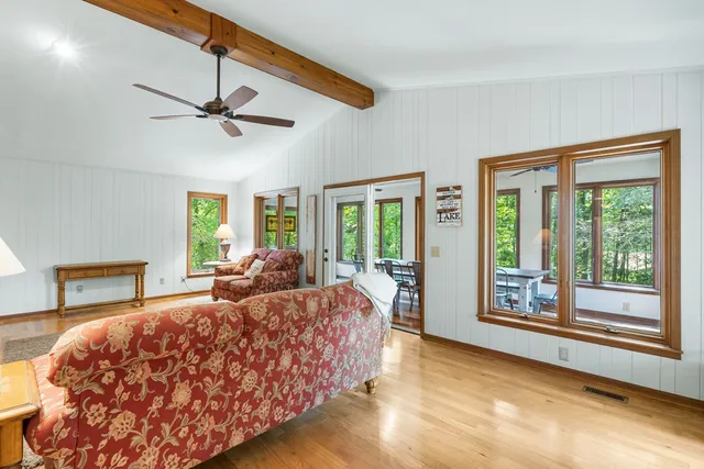 a large bedroom with a large bed and a large window