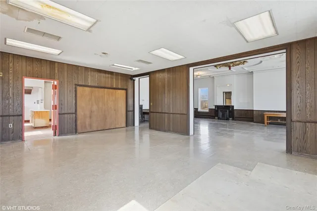 a kitchen with stainless steel appliances granite countertop a sink and a refrigerator