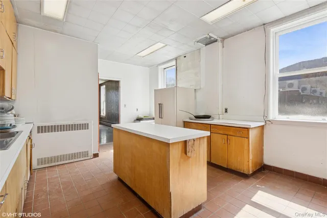 a view of a kitchen with a sink