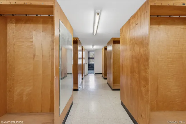 a room with pool table and windows