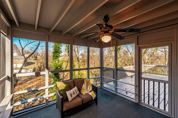 a living room with large windows