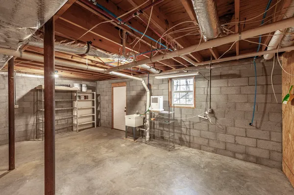 a view of an empty room with wooden roof