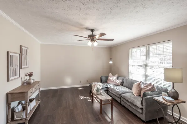 a living room with furniture and a window