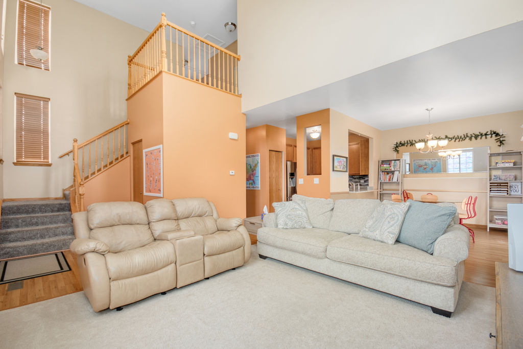 1070 Clover Drive Minooka, IL 60447 - Photo 2 of 15 a living room with furniture white walls and white walls