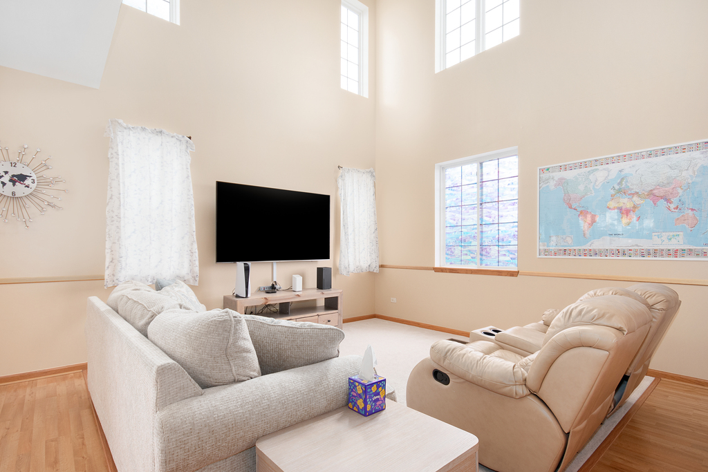1070 Clover Drive Minooka, IL 60447 - Photo 3 of 15 a living room with furniture and a flat screen tv