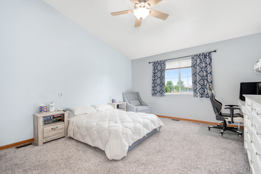 1070 Clover Drive Minooka, IL 60447 - Photo 8 of 15 a bedroom with bed and a window