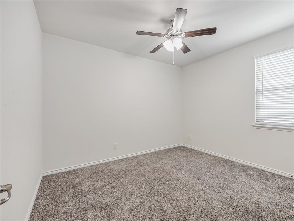 3024 Meredith Lane Forney, TX 75126 - Photo 16 of 29 Carpeted room featuring a ceiling fan with light fixture, window with blinds, and neutral wall paint